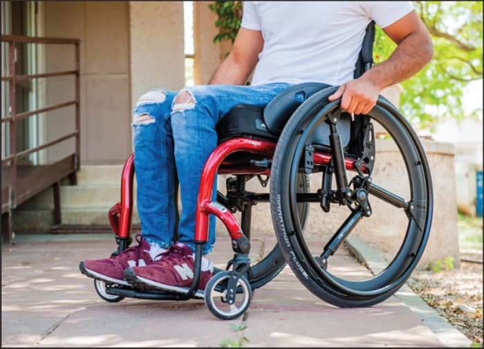 Man with wheelchair and SoftWheel wheels
