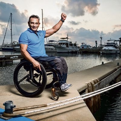Man with wheelchair and SoftWheel wheels in the Marina