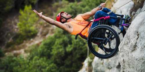 Man Rappelling with wheelchair and SoftWheel wheels