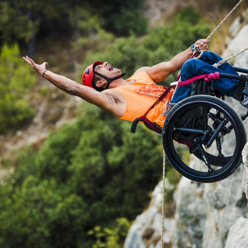 Man Rappelling with wheelchair and SoftWheel wheels